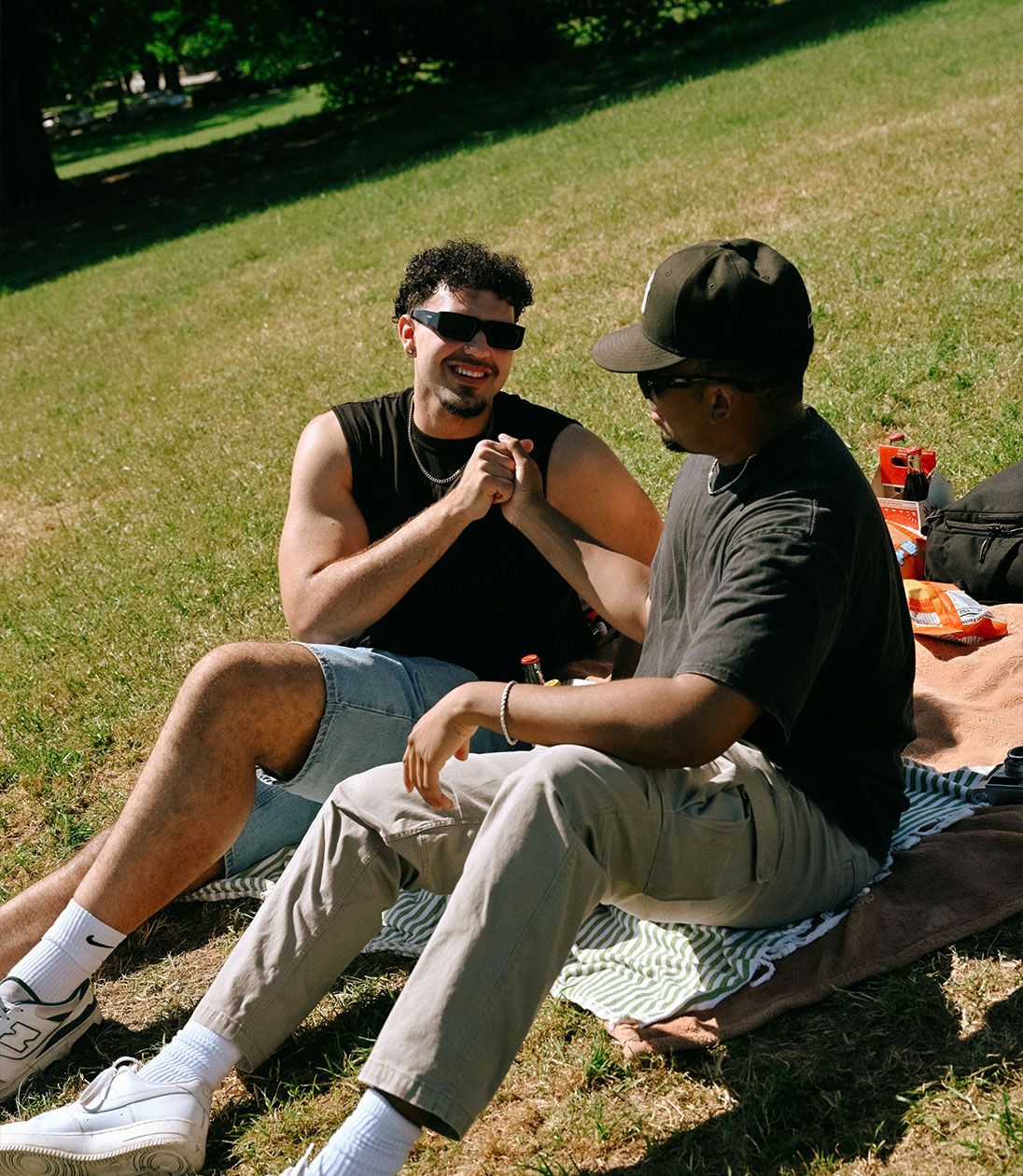 two men sitting outside
