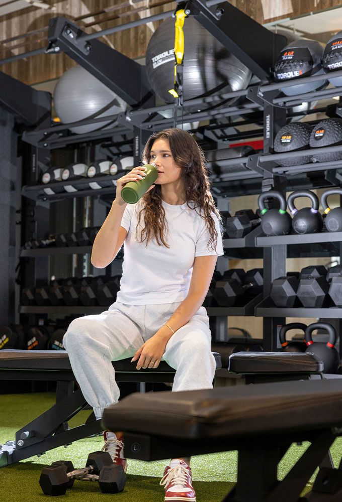 woman sitting in a gym